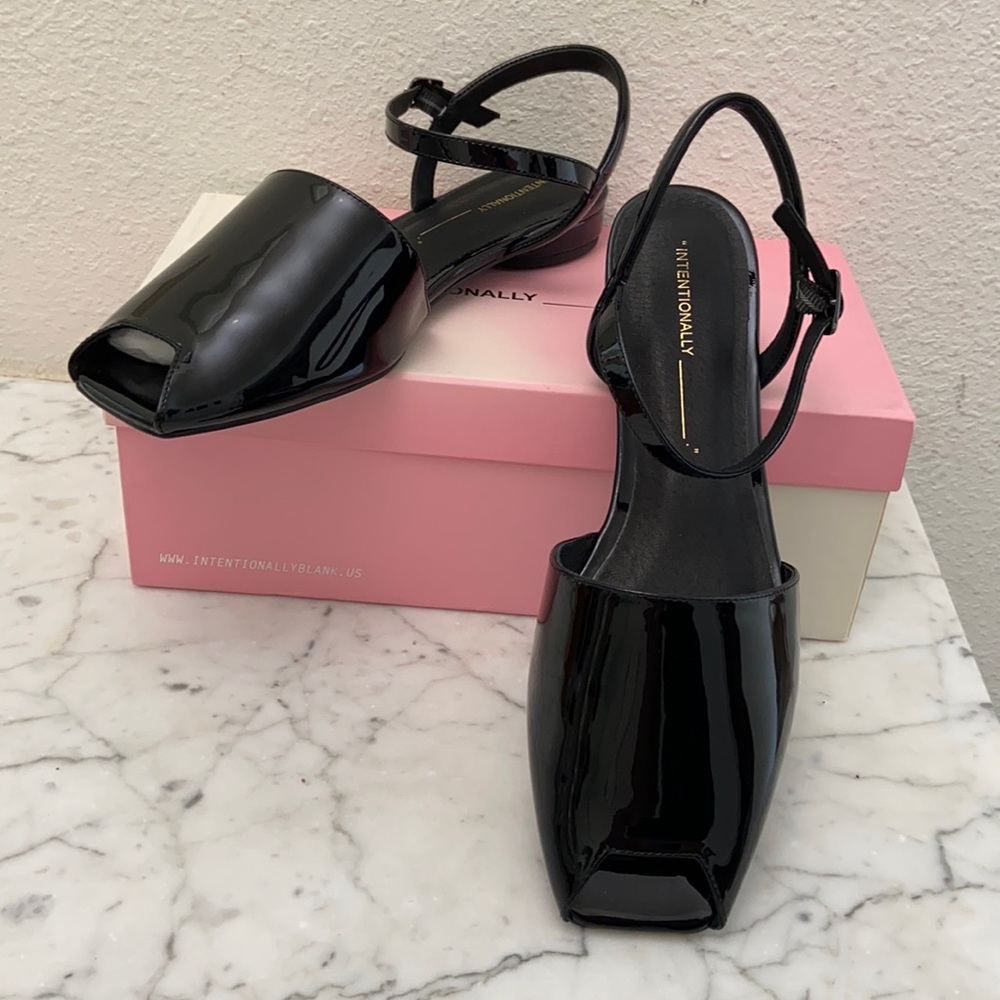 Intentionally black, patent leather sandals